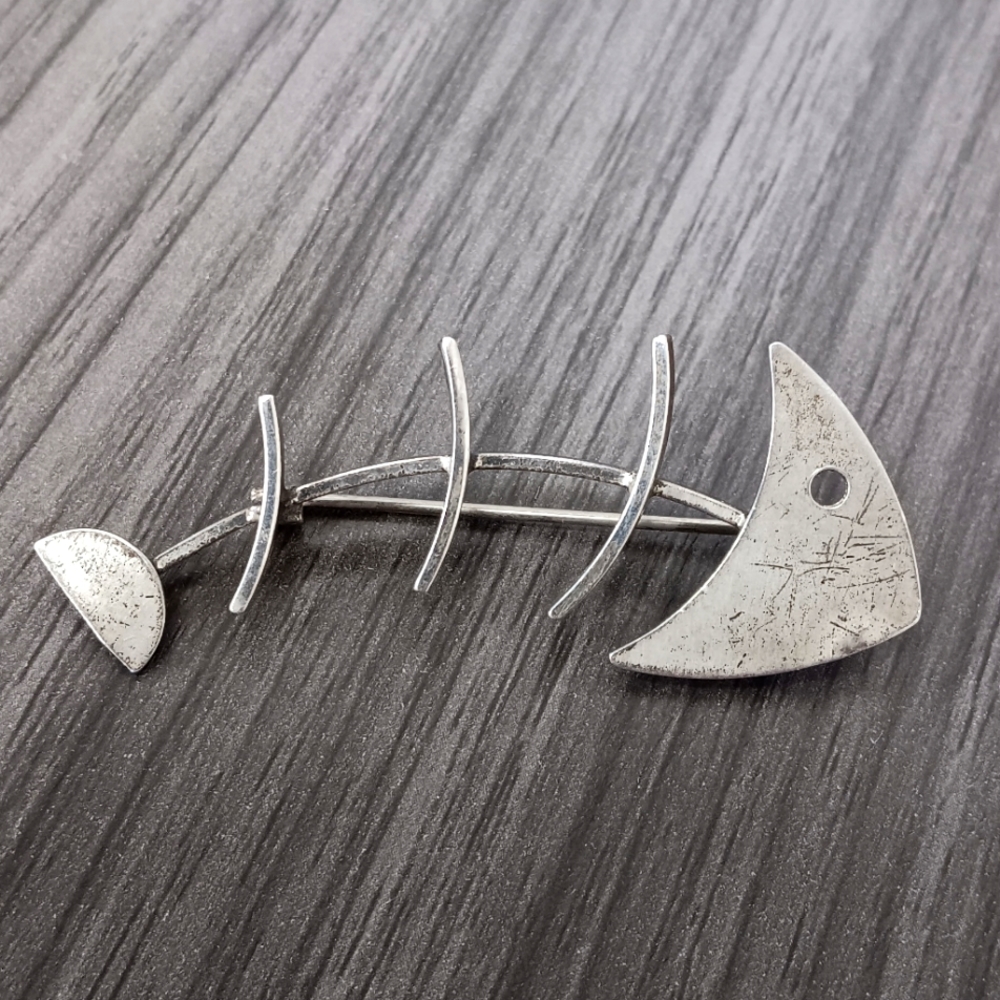 Silver fish skeleton pin stamped